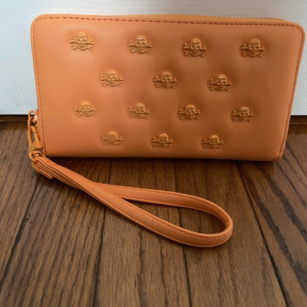 Betsy Johnson Orange Skull Studded Zip Around Wristlet Wallet.